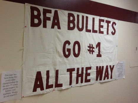 The caption reads, "This sign has been hung for every state championship for the past 35 year, please respect its history and tradition. Please do not touch!!!"