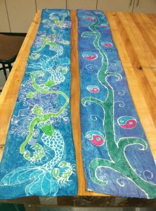 Completed scarves by Mrs. Garland (left) and Gracie B (Grade 9).