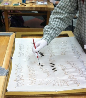 Chloe G (Grade 10) works on her design.