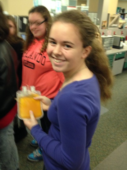 student holds plasma