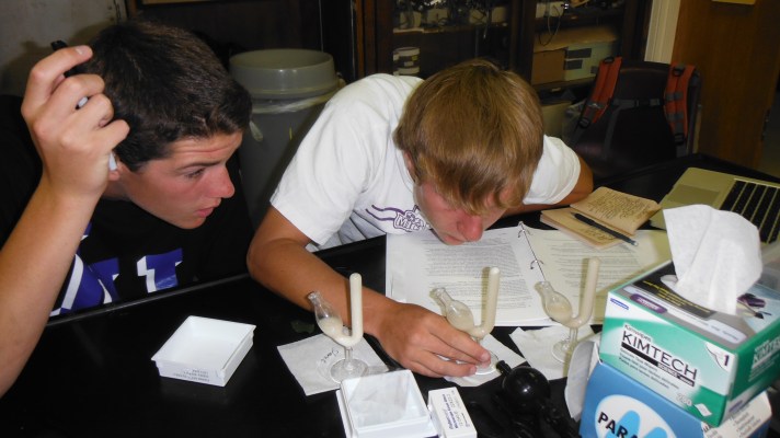 Dave Legris and Alex Ferguson measure respiration rate using specialized flasks.
