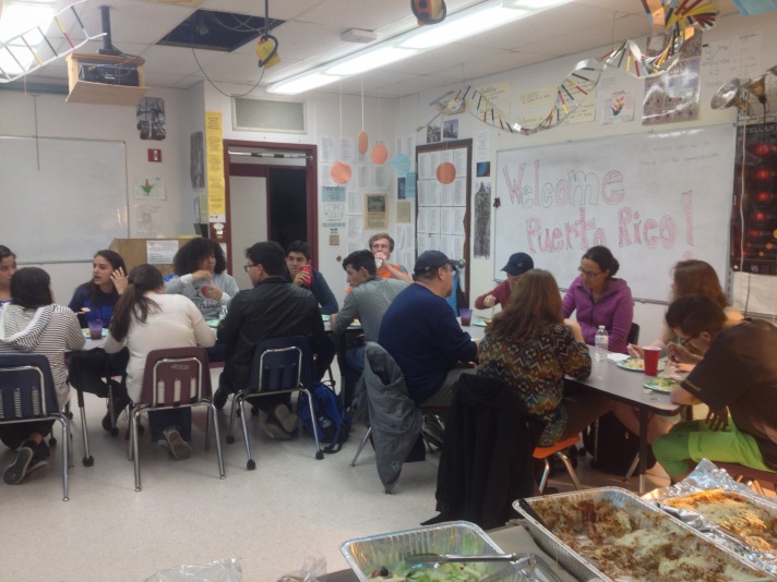 (Puerto Rican students, teachers and host families enjoy dinner in Mr. Lane’s science classroom at BFA HS.)