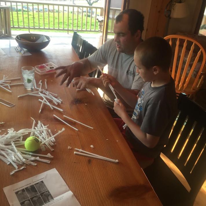 Third grader Magnus Riggs and his dad, Tucker, complete a home engineering challenge together over the weekend.