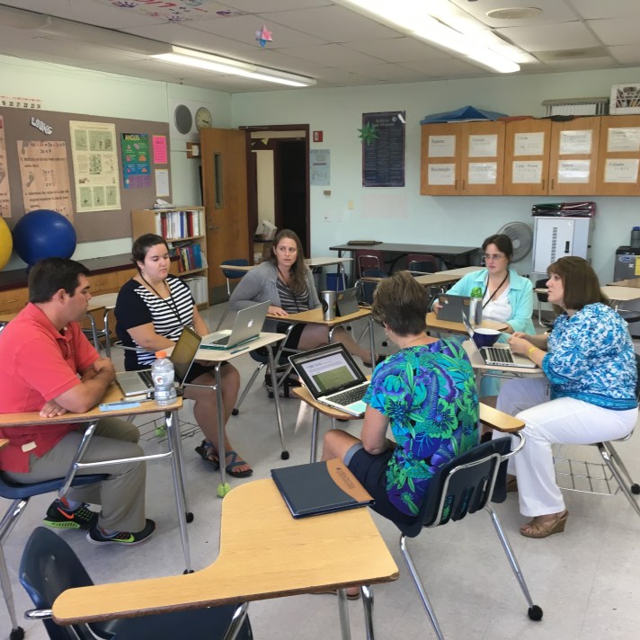 Karen Shearer with the 7th grade team discussing personalized learning plans.