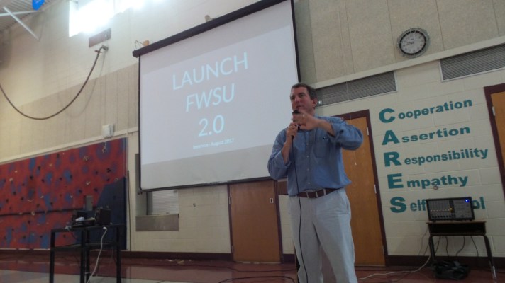 Superintendent Ned Kirsch talks with staff.