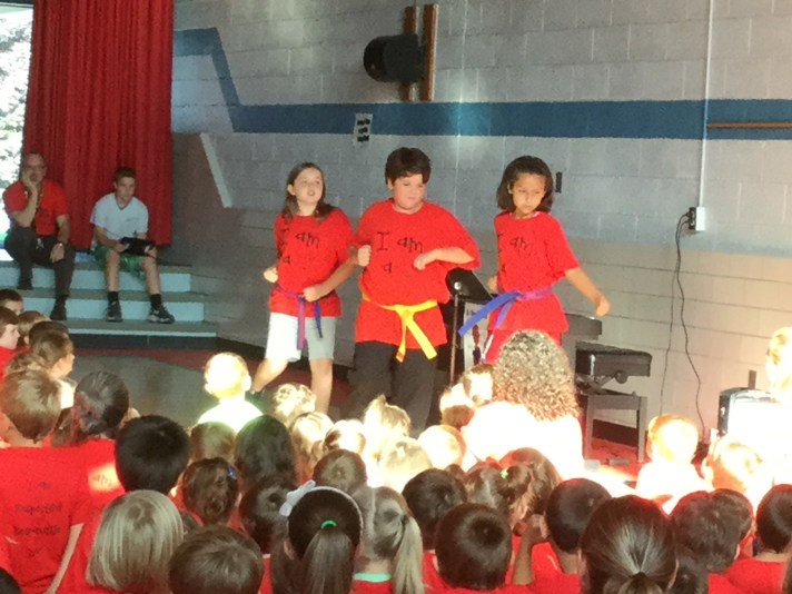 Students demonstrate Tae Kwon Do to their peers.