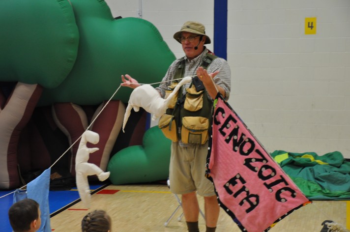 Dinoman, a.k.a. Warren, VT-resident Bob Lisaius, uses a clothesline and stuffed animals to teach Fletcher students about the Mesozoic Era and the creatures that lived at that time. 