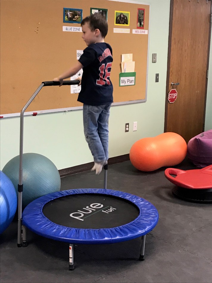 a student uses the mini trampoline on a brain break