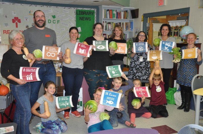 Parents and Students at Fletcher Elementary display the Global Goals