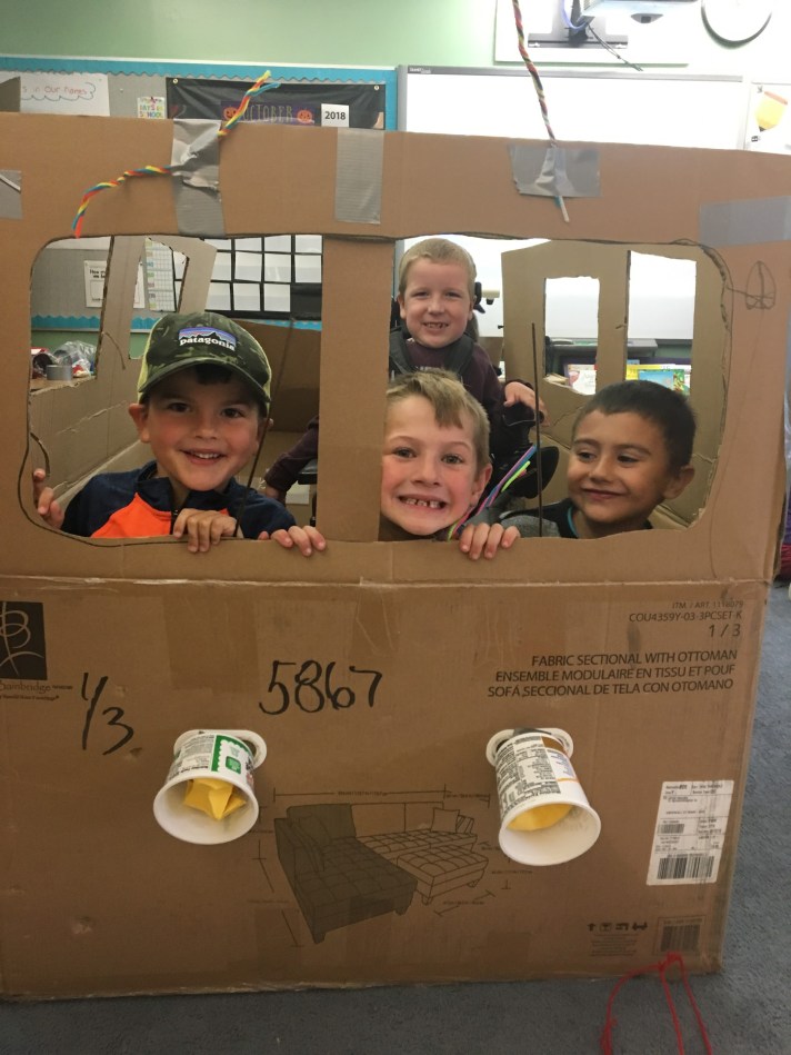 Students on the cardboard bus